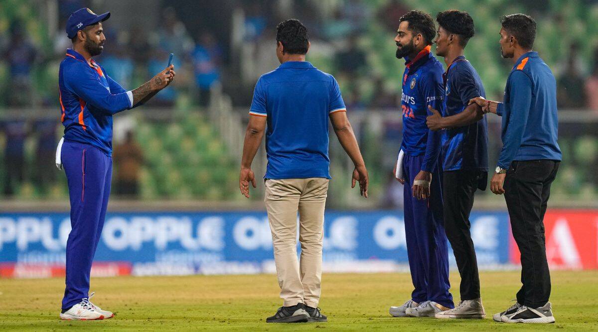 Virat Kohli SKY bond, Virat Kohli fan invades pitch, Suryakumar Yadav, Virat Kohli fan touch feet, Surya clicking kohli picture, Virat Kohli fan on field