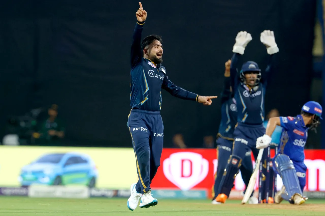 MI vs GT: Rashid Khan EXHIBITS All-rounder skills, Afghan Spinner claims four-fer & hammers Unbeaten FIFTY to save GT from Humiliating Loss - Rashid Khan vs MI