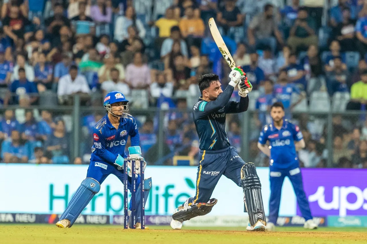 MI vs GT: Rashid Khan EXHIBITS All-rounder skills, Afghan Spinner claims four-fer & hammers Unbeaten FIFTY to save GT from Humiliating Loss - Rashid Khan vs MI